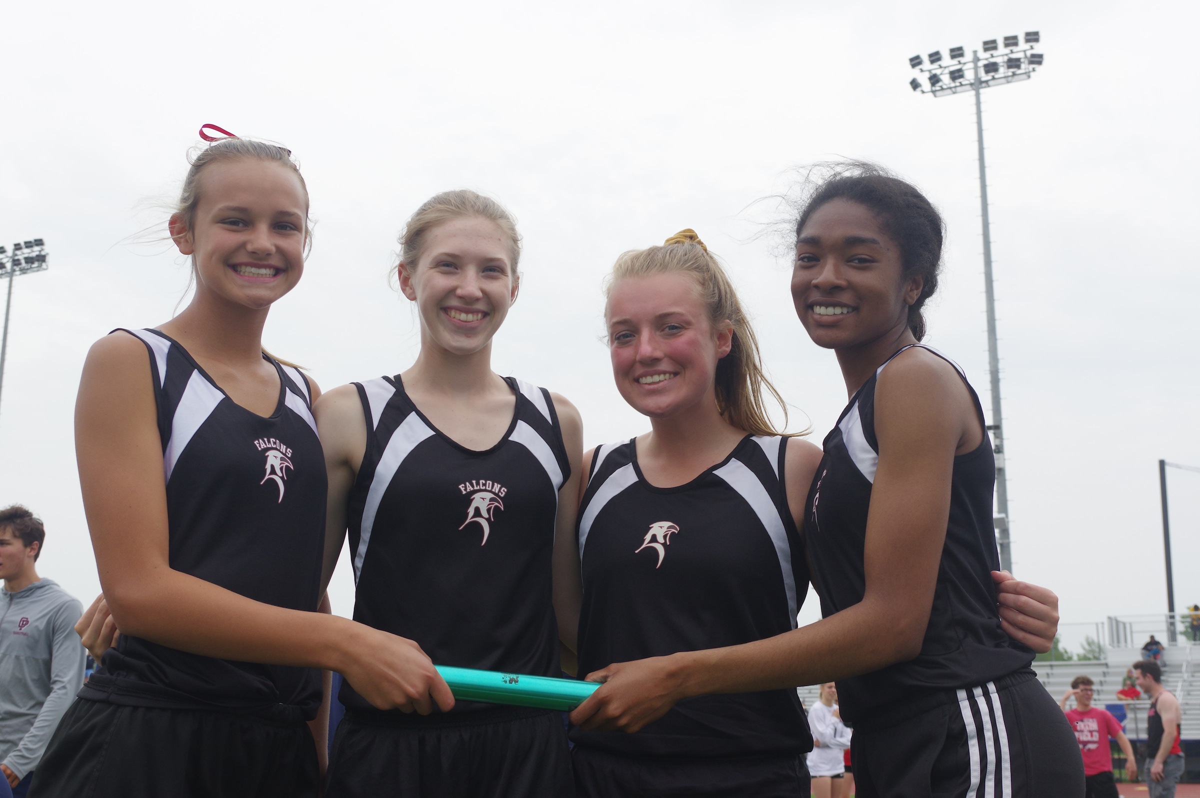 From left, the school record-breaking 4x400 relay team of Maddi Fike, MacKenzie Patterson, Abby Mason and Le'Gary Jackson pose at the Section VI meet last Saturday. (Photo by Larry Austin)